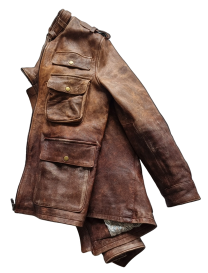 Brown leather jacket with multiple pockets on a black background